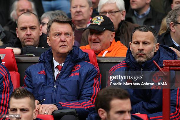 Manchester United Manager Louis van Gaal looks on with Assistant Ryan Giggs during the Barclays Premier League match between Manchester United and...