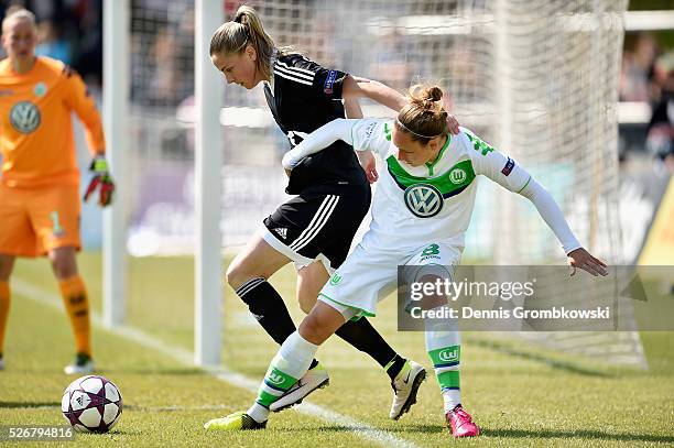 Babett Peter of VfL Wolfsburg challenges Ana-Maria Crnogorcevic of 1. FFC Frankfurt during the UEFA Women's Champions League Semi Final second leg...