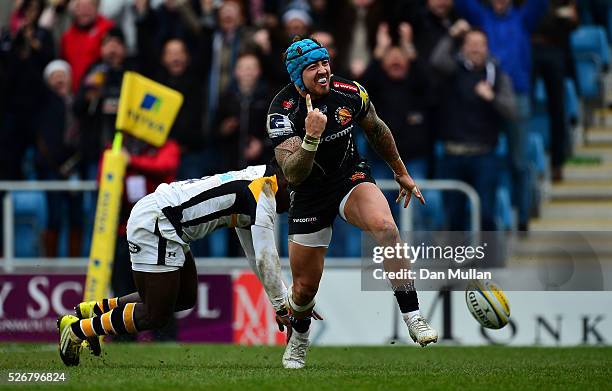 Jack Nowell of Exeter Chiefs celebrates scoring his side's third try past Christian Wade of Wasps during the Aviva Premiership match between Exeter...