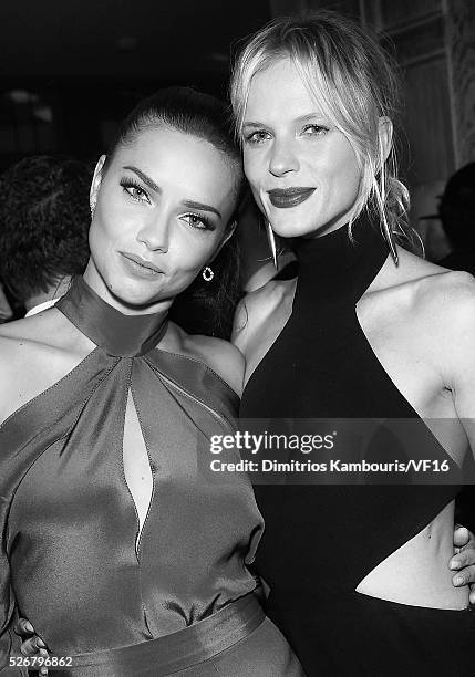 Adriana Lima and Anne Vyalitsyna attend the Bloomberg & Vanity Fair cocktail reception following the 2015 WHCA Dinner at the residence of the French...