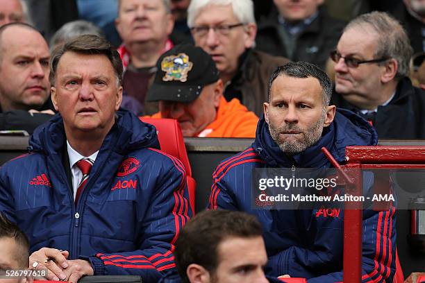 Manchester United Manager Louis van Gaal looks on with Assistant Ryan Giggs during the Barclays Premier League match between Manchester United and...