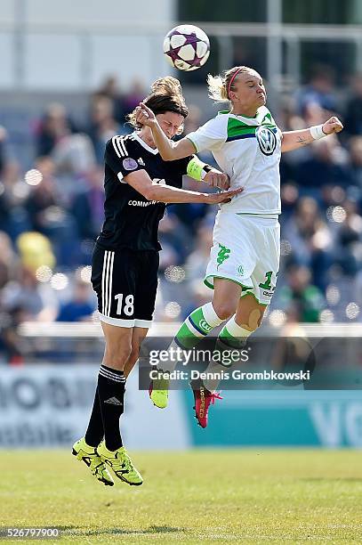 Kerstin Garefrekes of 1. FFC Frankfurt and Alexandra Popp of VfL Wolfsburg go up for a header during the UEFA Women's Champions League Semi Final...