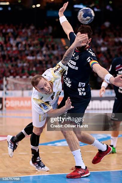Robert Weber of Magdeburg challenges for the ball with Tobias Karlsson of Flensburg during the DKB REWE Final Four Finale 2016 between SG Flensburg...