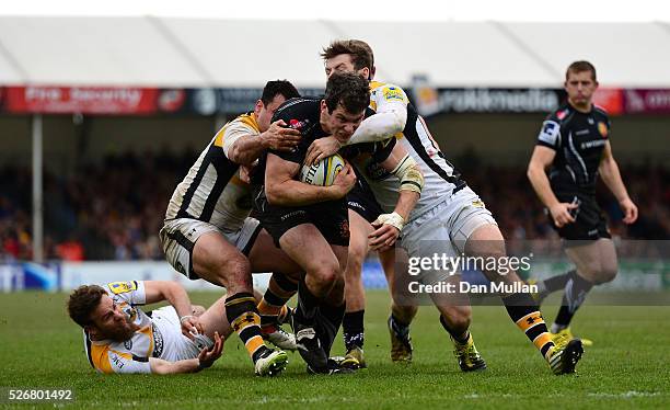 Ian Whitten of Exeter Chiefs is tackled by George Smith and Elliot Daly of Wasps during the Aviva Premiership match between Exeter Chiefs and Wasps...