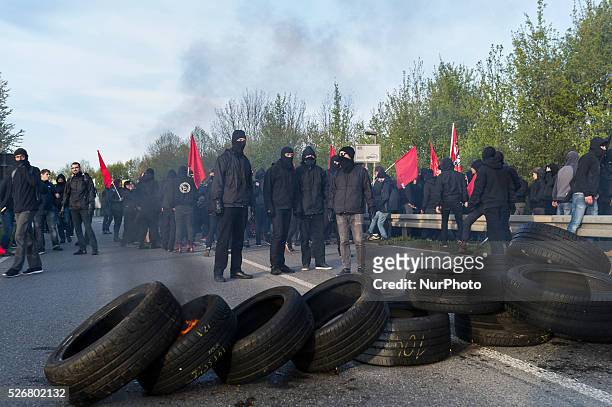 Demonstrators block the way for the AfD delegate to the Alternative fuer Deutschland political party federal congress on April 30, 2016 in Stuttgart,...