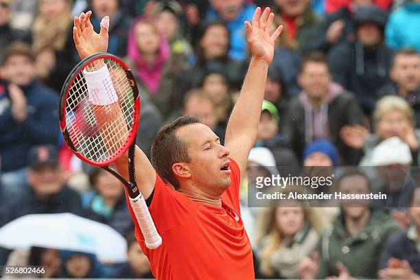 Philipp Kohlschreiber of Germany celebrates winning his finale match against Dominic Thiem of Austria of the BMW Open at Iphitos tennis club on May...