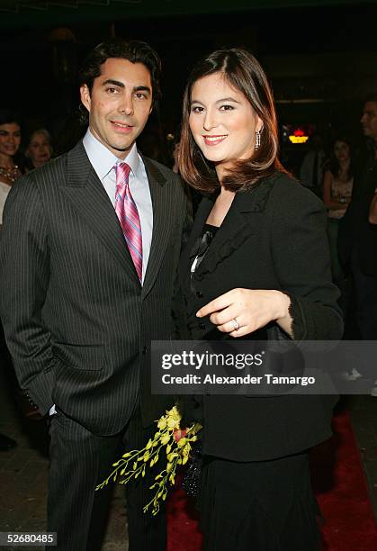 Fashion designer Nicolas Felizola and singer and actress Chabeli Iglesias arrive at the grand opening of the Nicolas Felizola store on April 21, 2005...