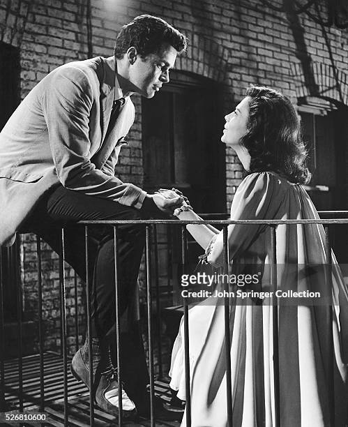 Richard Beymer and Natalie Wood in fire-escape scene from the film, "West Side Story." In this photo, "Tony" and "Maria" are shown holding hands.