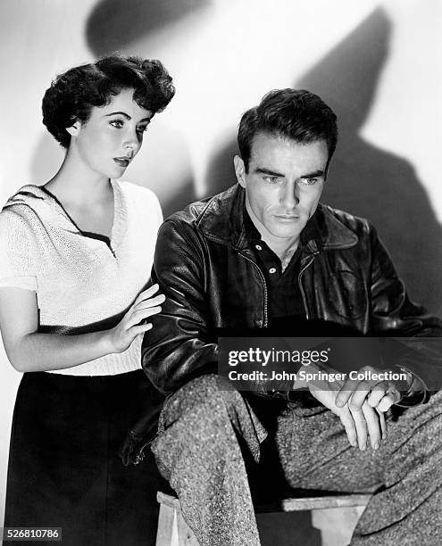 Actress Elizabeth Taylor plays Angela Vickers alongside Montgomery Clift's character George Eastman in the 1951 film A Place in the Sun.