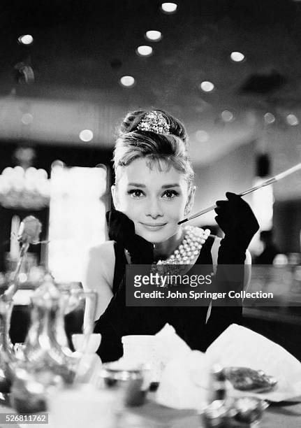 Audrey Hepburn in evening gloves and tiara in Blake Edwards' Breakfast at Tiffany's.