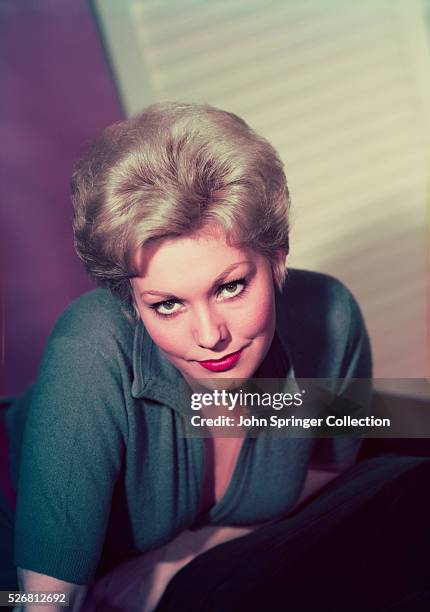 Actress Kim Novak Leaning on Chair