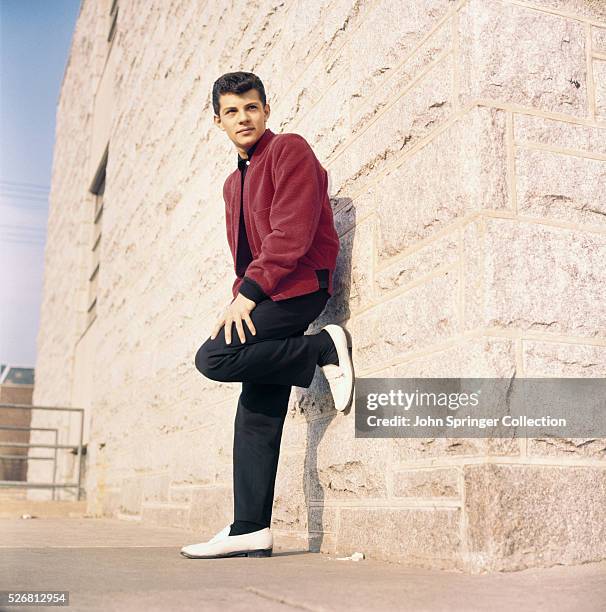 Actor Frankie Avalon Leaning on Building