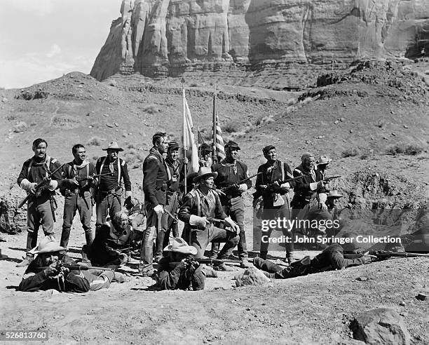 Small army group waits for a battle with a Native American war party in the 1948 film Fort Apache.