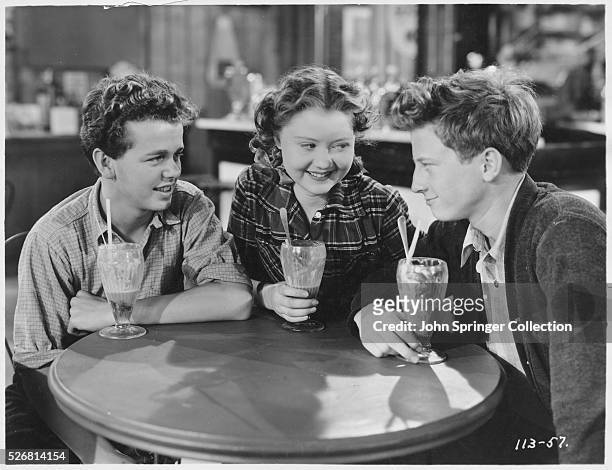 Barefoot Boy stars Jackie Moran, Marcia Mae Jones, and Bradley Metcalfe enjoy milk shakes at the soda fountain.