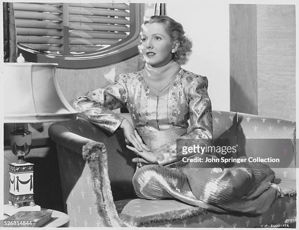 Actress Jean Arthur Sitting in a Chair