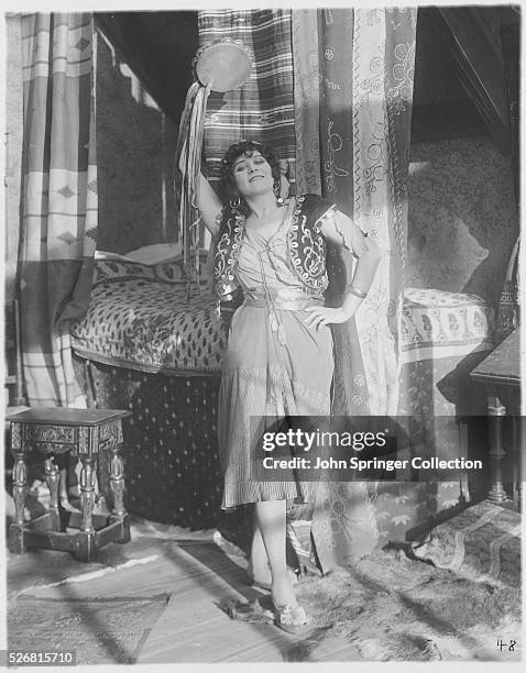 Theda Bara plays Esmeralda in The Darling of Paris, the 1917 film adaptation of Hugo's The Hunchback of Notre Dame. | Version of: 'The Hunchback of...