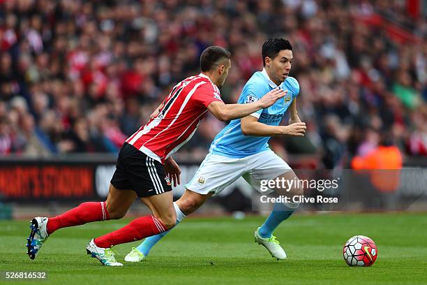 Samir Nasri of Manchester City takes on Dusan Tadic of Southampton during the Barclays Premier League match between Southampton and Manchester City...