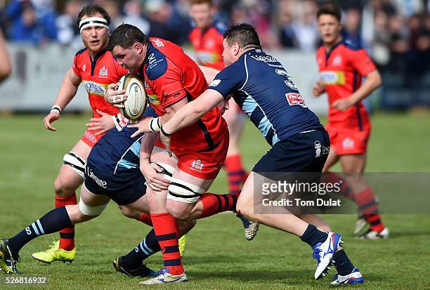 James Phillips of Bristol Rugby is tackled during the Greene King IPA Championship Play Off Semi Final first leg match between Bedford Blues and...