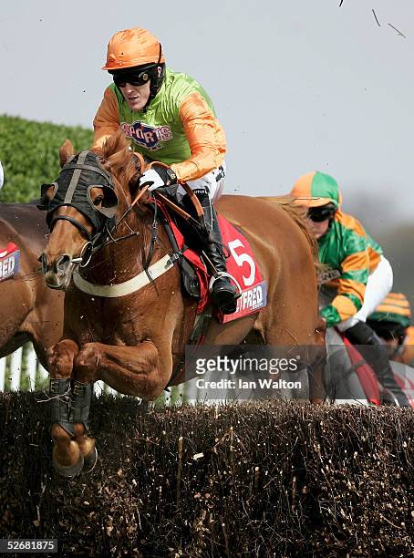 McCoy and Tikram in action during the Betfred '500 Shops Nationwide' handicap steeple chase at Sandown Park on April 22, 2004 in Sandown, England.