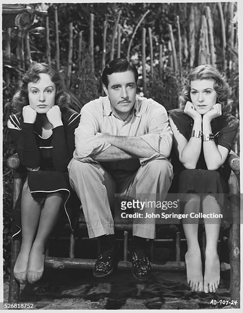 Madge Evans as Anne Wesson, John Boles as Jim Taylor, and Charlotte Wynters as Thelma Chase in the 1938 movie Sinners in Paradise.