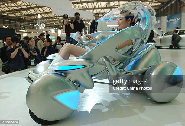 Model sits in a new Toyota I-unit concept car at the Auto Shanghai 2005 Exhibition on April 21, 2005 in Shanghai, China. Top world automakers are...