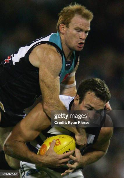 Peter Walsh 42# for the Power tackles Brad Ottens for the Cats during the round five AFL match between the Port Adelaide Power and the Geelong Cats...