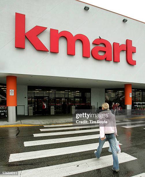 Woman walks towards a newly revamped Kmart store April 22, 2005 in Norridge, Illinois. This particular store is one of nine "test stores" where some...