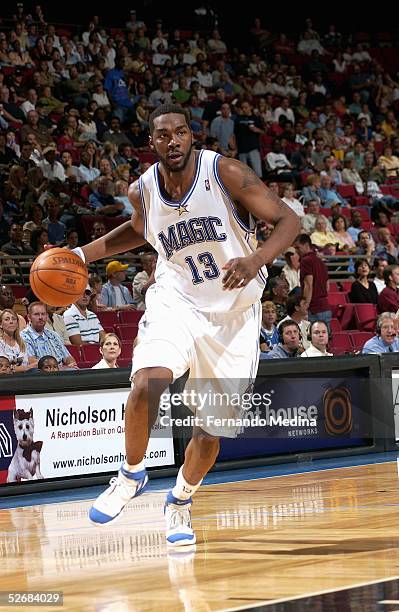 Kelvin Cato of the Orlando Magic drives against the Washington Wizards during a game at TD Waterhouse Centre on April 1, 2005 in Orlando, Florida....