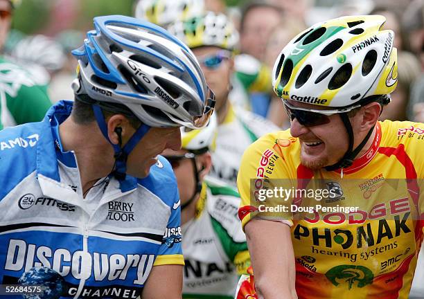 Floyd Landis of the USA of Phonak Hearing Systems chats with former teammate Lance Armstrong of the USA of Discovery Channel Pro Cycling Team at the...