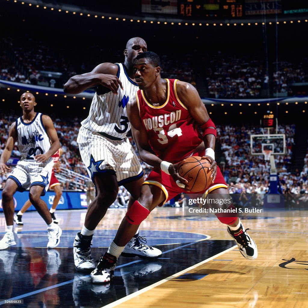 Hakeem Olajuwon Of The Houston Rockets Stops His Drive Into The Lane hakeem-olajuwon-of-the-houston-rockets-stops-his-drive-into-the-lane