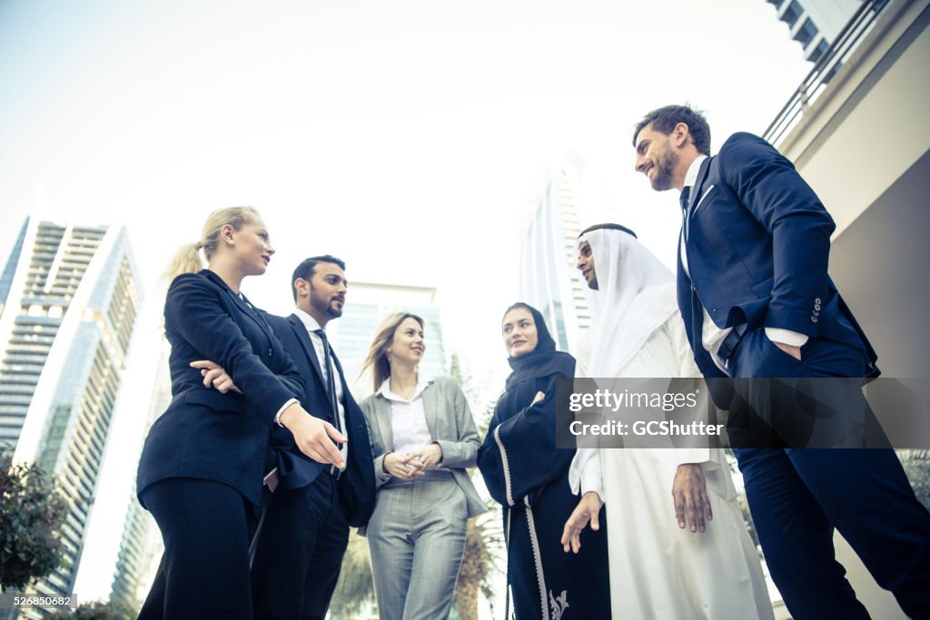 Middle Eastern Business Men Talking with Foreign Expats