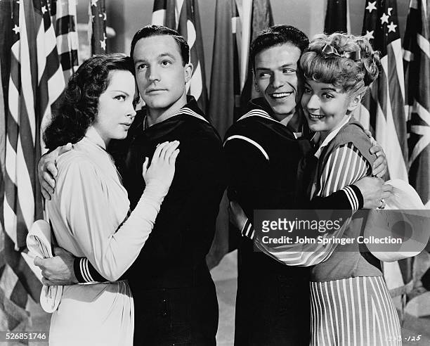 KATHRYN GRAYSON, GENE KELLY, FRANK SINATRA, AND PAMELA BRITTON IN A SCENE FROM THE 1945 FILM ANCHORS AWEIGH. MOVIE STILL.