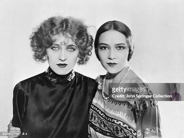 Actresses Rita Carewe and Dolores Del Rio stand together after being awarded First National contracts from Rita's father Edwin Carewe, who is a...