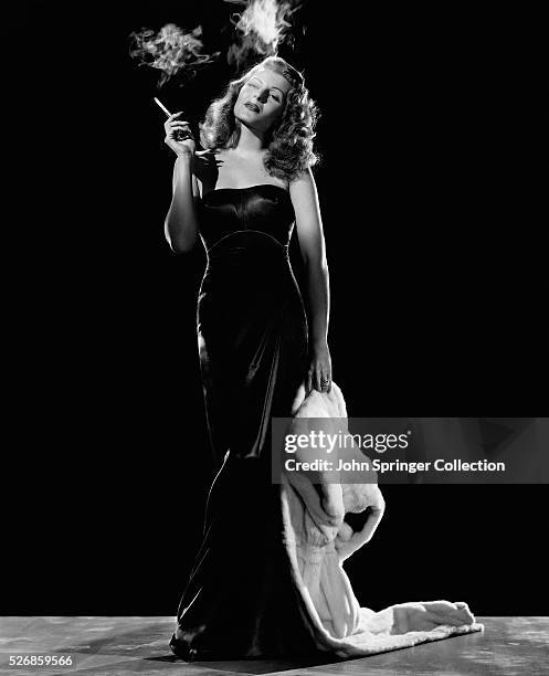 Actress Rita Hayworth Smoking a Cigarette