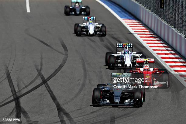 Nico Rosberg of Germany driving the Mercedes AMG Petronas F1 Team Mercedes F1 WO7 Mercedes PU106C Hybrid turbo leads Kimi Raikkonen of Finland...