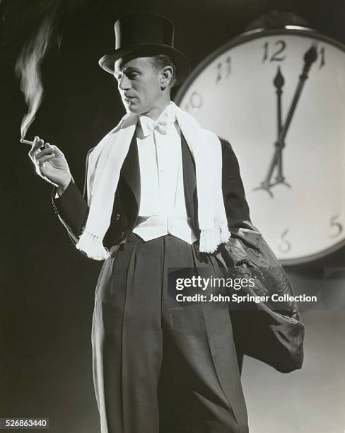 Leslie Howard, dapper in white tie and tails as Basil Underwood, in a publicity still from It's Love I'm After.