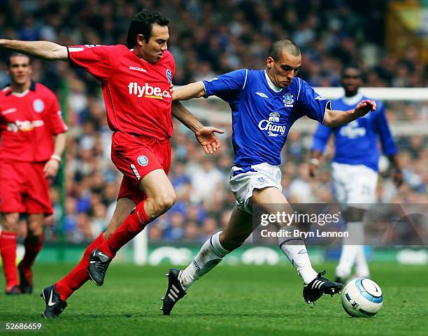 Stan Lazardis of Birmingham City tackles Leon Osman of Everton during the Barclays Premiership match between Everton and Birmingham City at Goodison...