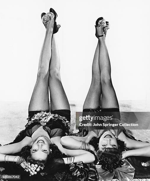 Jinx Falkenburg and Joan Woodbury sport fish net stockings for the 1941 film Two Latins from Manhattan.