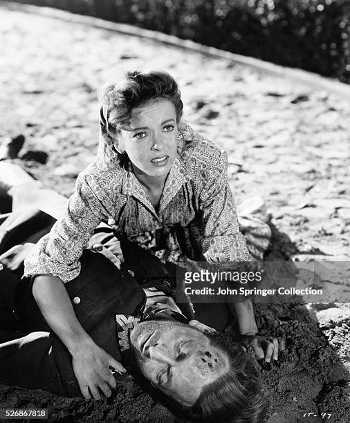 Jennifer Whittredge helps an injured Count Stephen Orvid in a scene from the 1944 film In Our Time.