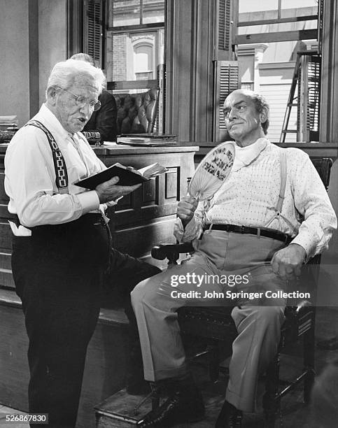 Attorney Henry Drummond cross-examines Matthew Harrison Brady in a scene from the 1960 film Inherit the Wind.