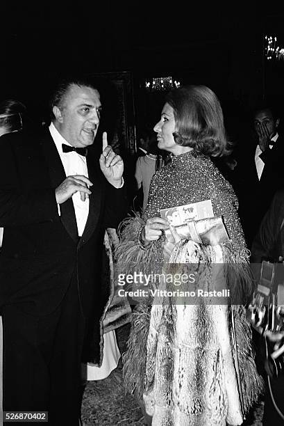 Italian director and screenwriter Federico Fellini with Romilda Villani, mother of actress Sophia Loren.