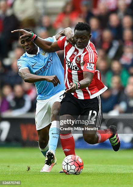 Victor Wanyama of Southampton and Kelechi Iheanacho of Manchester City tussle for the ball during the Barclays Premier League match between...