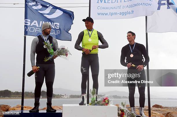 Oliver Tweddell of Australia and Jake Lilley of Australia and Jonathan Lobert of France compete in the Laser race boat during the Sailing World Cup...