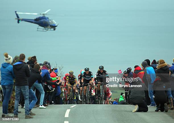 Gianni Moscon and Nicolas Roche of Team SKY and Thomas Voeckler of France and Direct Energie climb out of Robin Hood's Bay on stage three of the 2016...