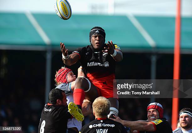 Maro Itoje of Saracens is tackled by Mouritz Botha of Newcastle Falcons during the Aviva Premiership match between Saracens and Newcastle Falcons at...