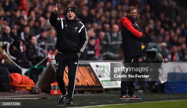 Swansea City coach Francesco Guidolin reacts during the Barclays Premier League match between Swansea City and Liverpool at The Liberty Stadium on...