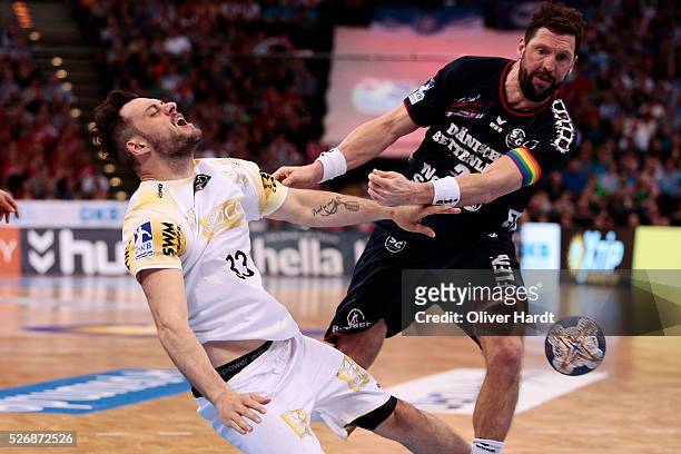 Rasmus Jens Schoengarth of Magdeburg challenges for the ball with Tobias Karlsson of Flensburg during the DKB REWE Final Four Finale 2016 between SG...