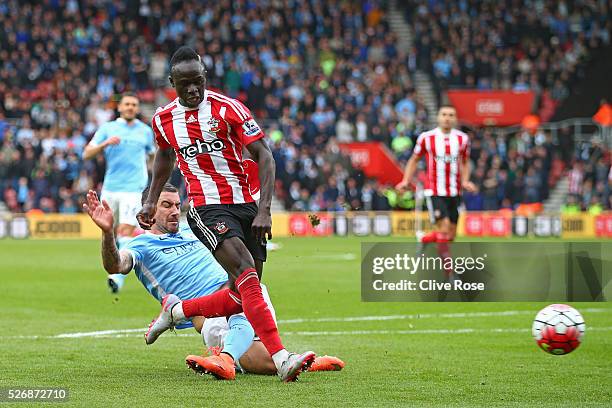 Sadio Mane of Southampton beats Aleksandar Kolarov of Manchester City as he scores his third goal and his team's fourth during the Barclays Premier...