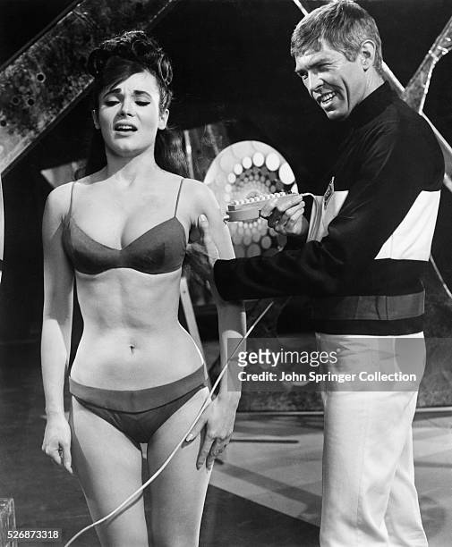 James Coburn and Gila Golan in a scene from the 1966 film, Our Man Flint. It was a James Bond spoof about a spy who takes on villains that want to...