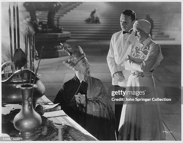 Warner Oland, Herbert Marshall and Greta Garbo in a scene from the 1934 motion picture, The Painted Veil.